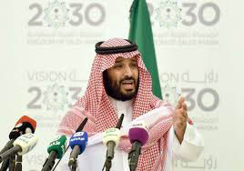 Foto van prins Mohammed met op de achtergrond logo Visie 2030