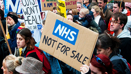Foto demo met leuze NHS not for sale